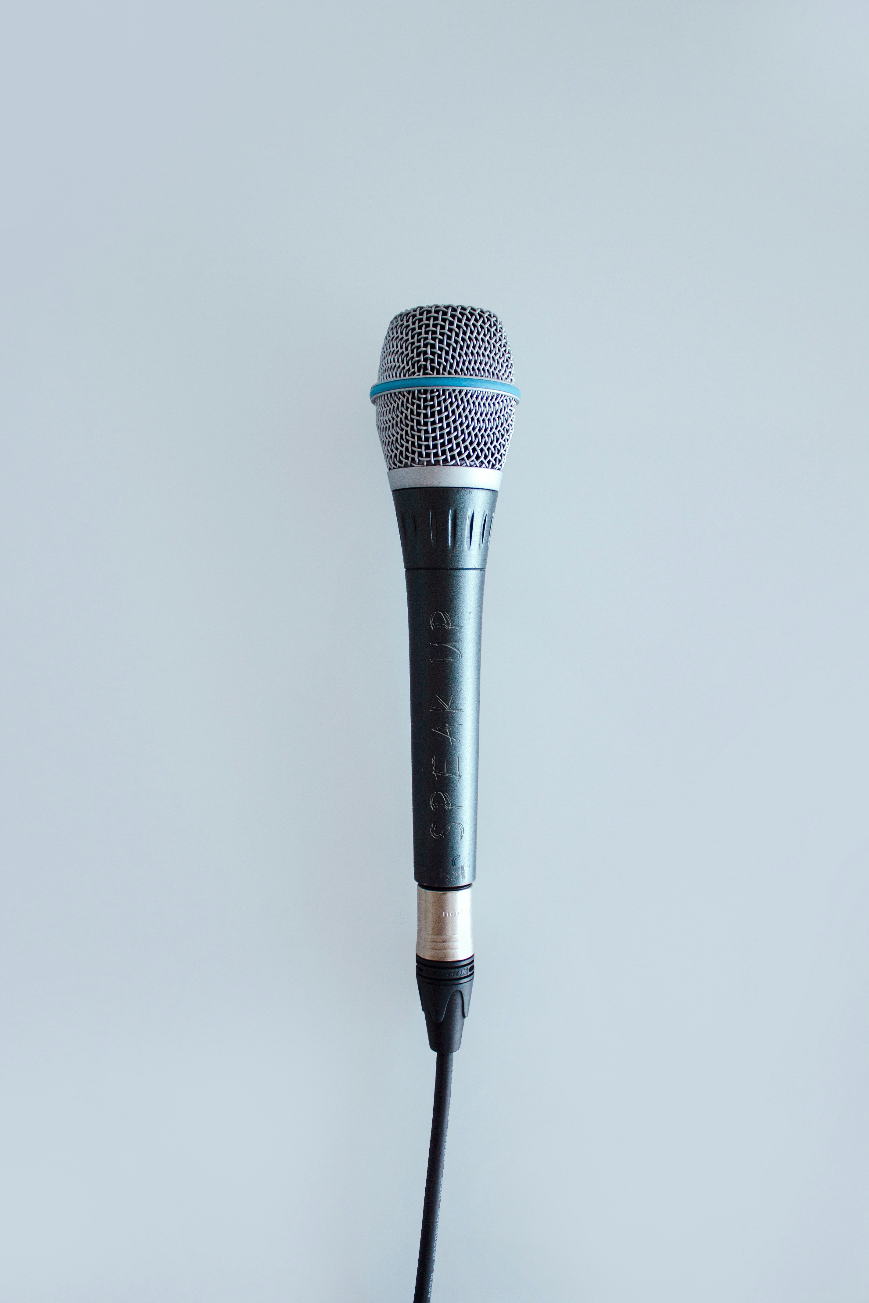 black and gray corded microphone